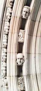 picture showing heads sticking out from a building