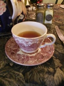 Picture taken at a quaint Victorian tea place my women colleagues go for holiday tea every December. Love the tea, but not the cup- I drink from large ceramic mugs!